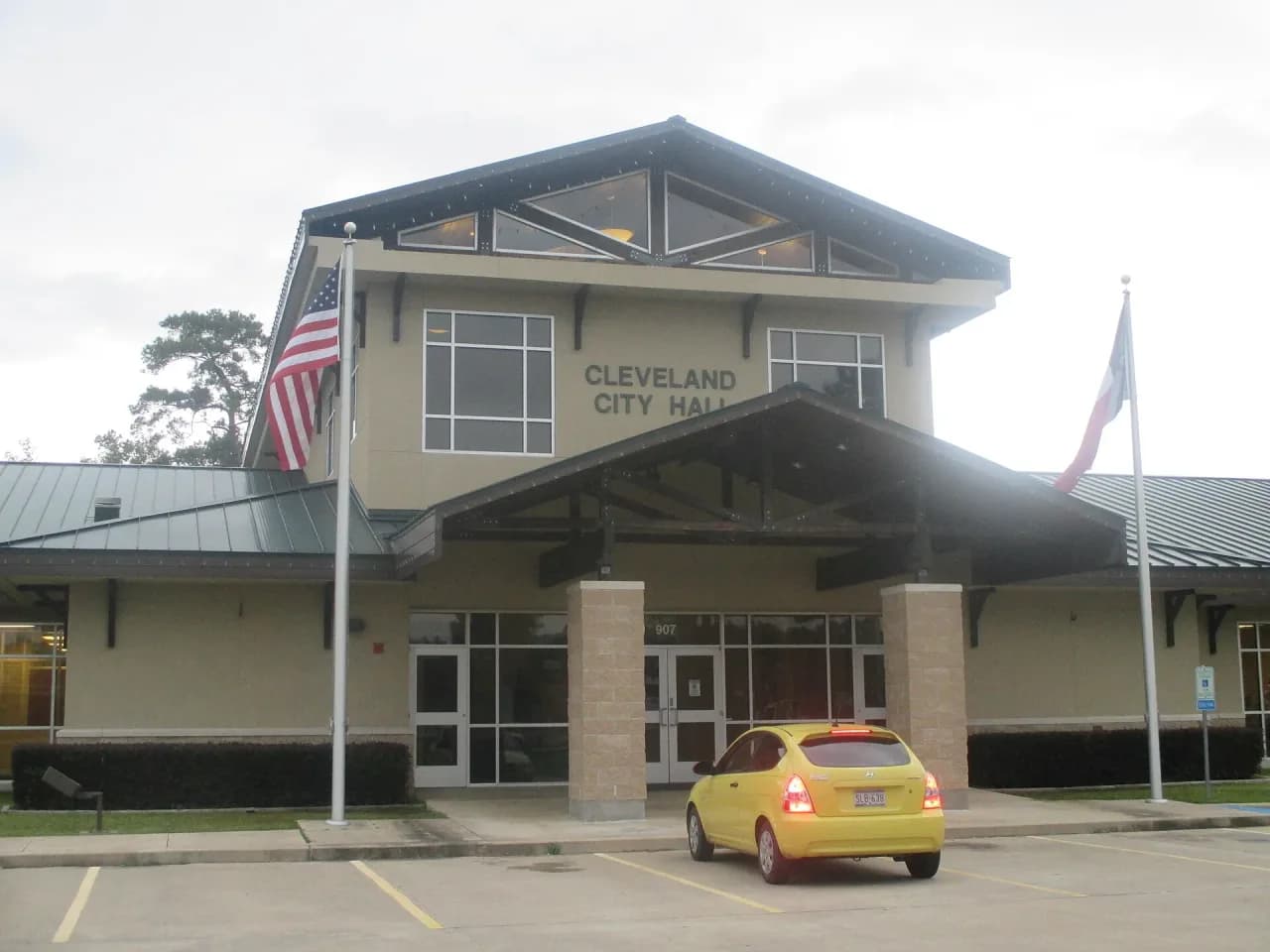 Cleveland City Hall in Cleveland, Texas, with the American and Texas flags