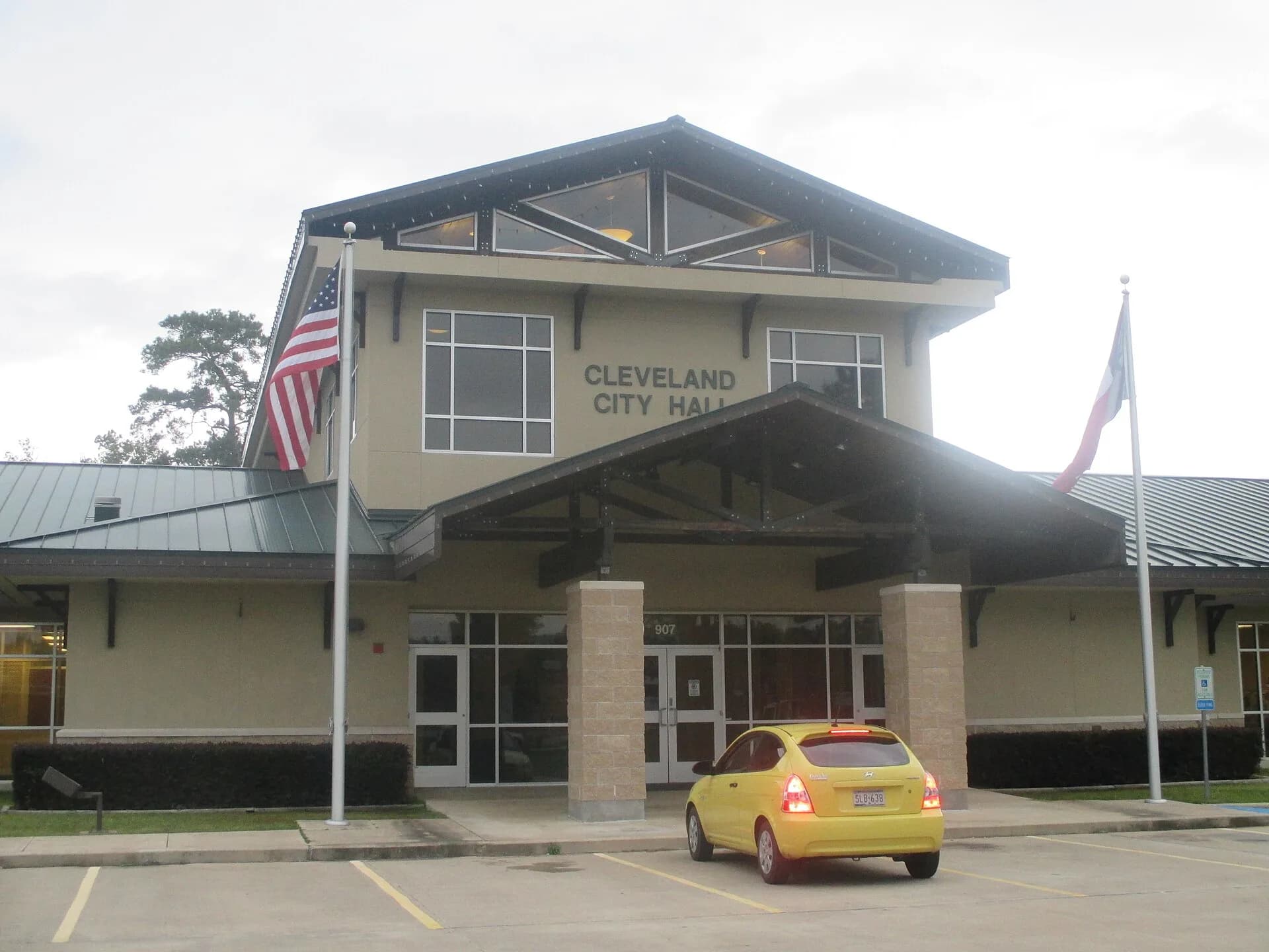 Cleveland City Hall in Cleveland, Texas, with the American and Texas flags