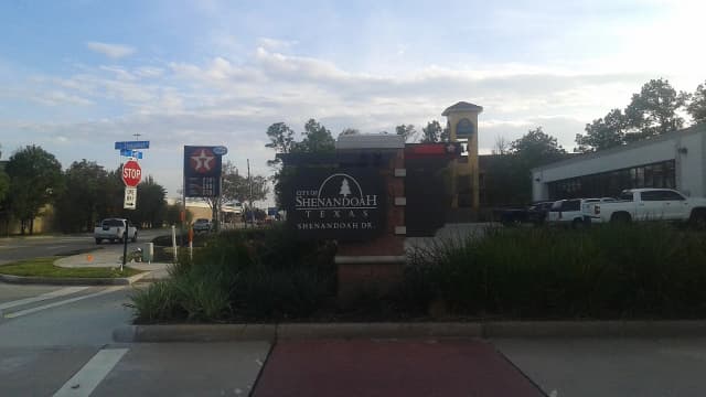 City of Shenandoah, Texas entrance sign on Shenandoah Drive, with an Interstate 45 shield nearby