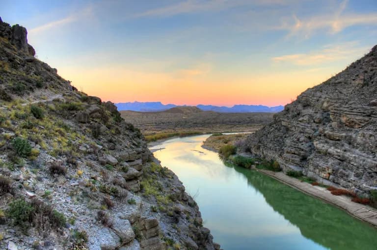 The Rio Grande leaving Santa Elena Canyon in Big Bend National Park, with the Chisos Mountains beyond