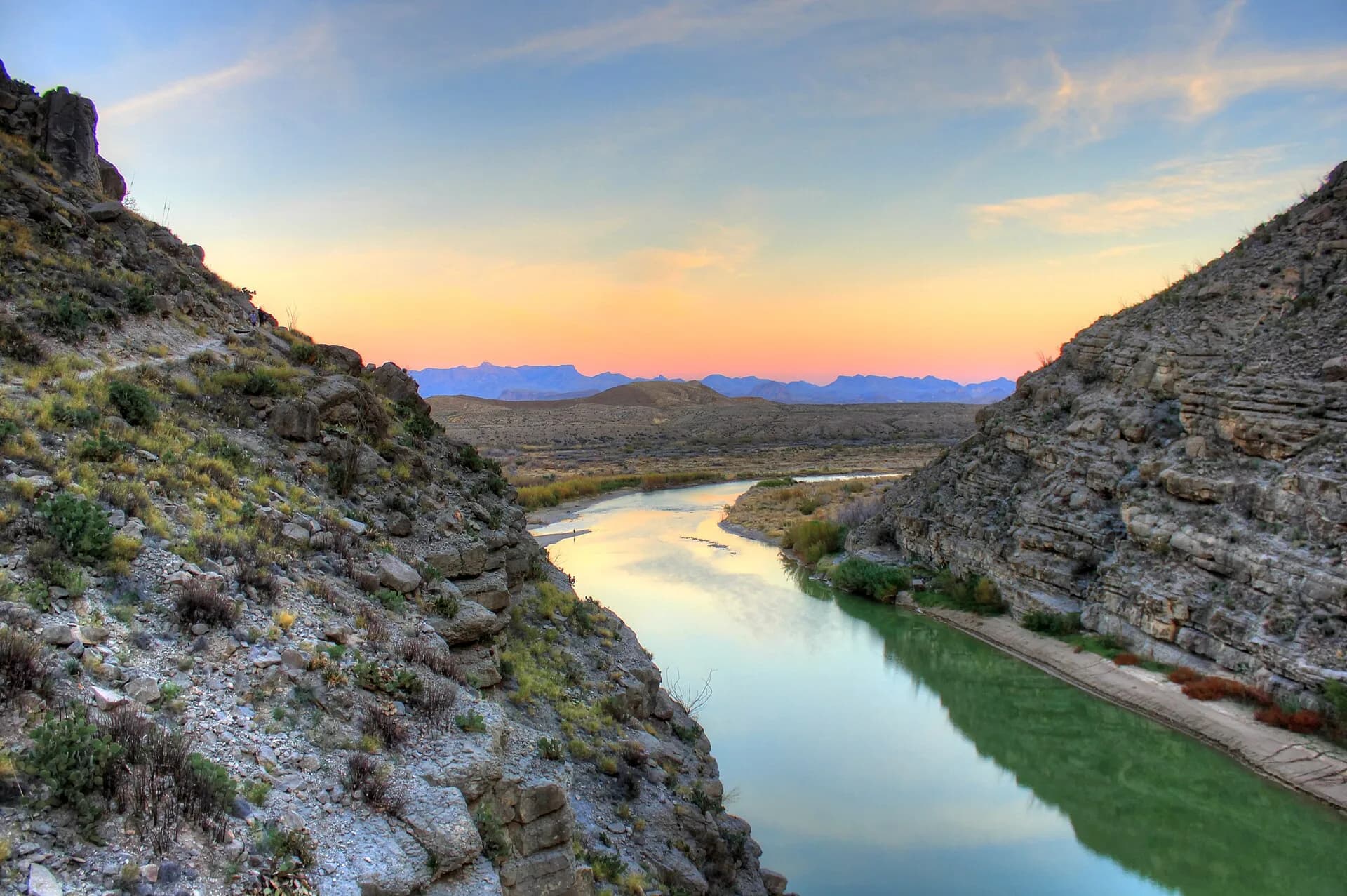 The Rio Grande leaving Santa Elena Canyon in Big Bend National Park, with the Chisos Mountains beyond