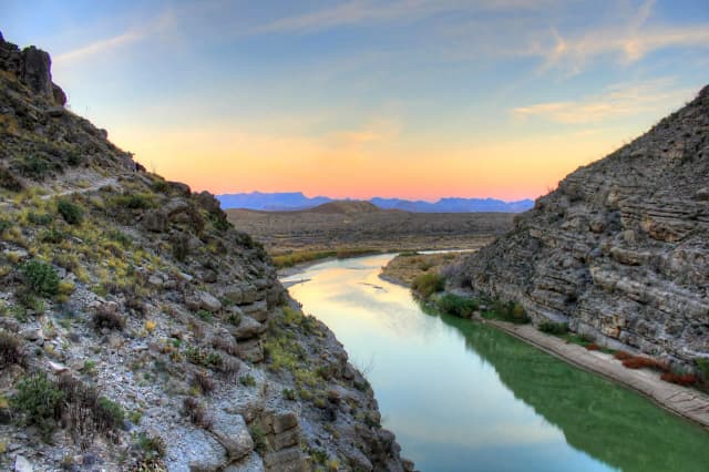 The Rio Grande leaving Santa Elena Canyon in Big Bend National Park, with the Chisos Mountains beyond