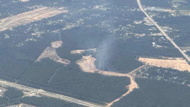 Aerial view of cleared land, roads and wooded tracts near Porter Heights in Montgomery County, Texas