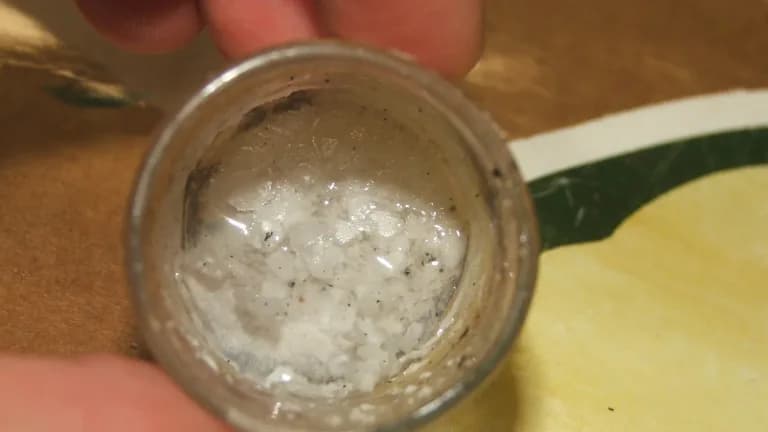 A sample of lithium hydroxide with carbonate growths