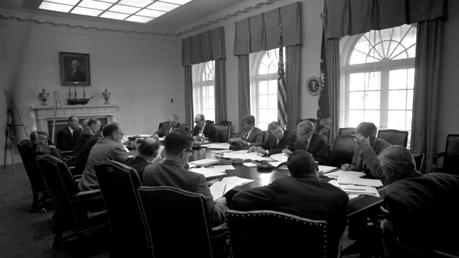 President Kennedy meets with members of the Executive Committee of the National Security Council around a table