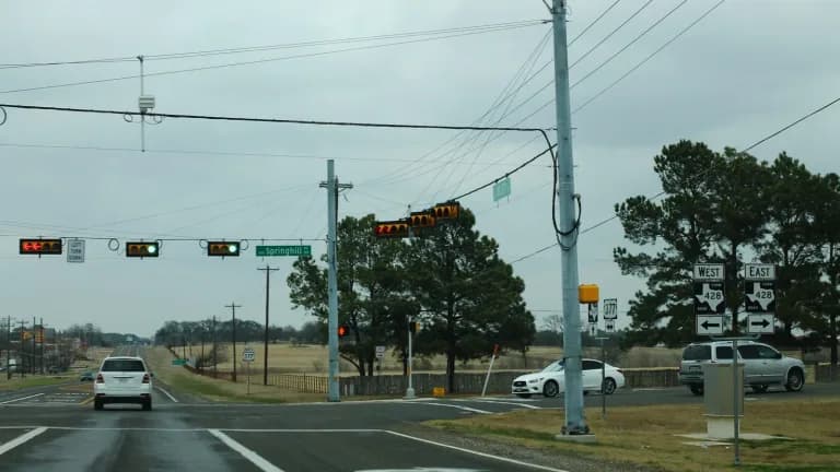 Traffic signals and FM 428 route signs at the U.S. 377 intersection in Denton County