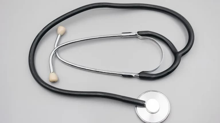 A stethoscope on a light gray surface