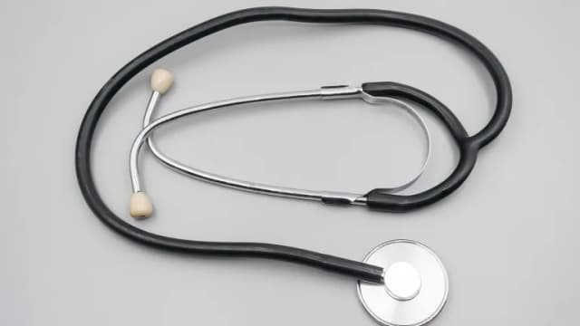 A stethoscope on a light gray surface