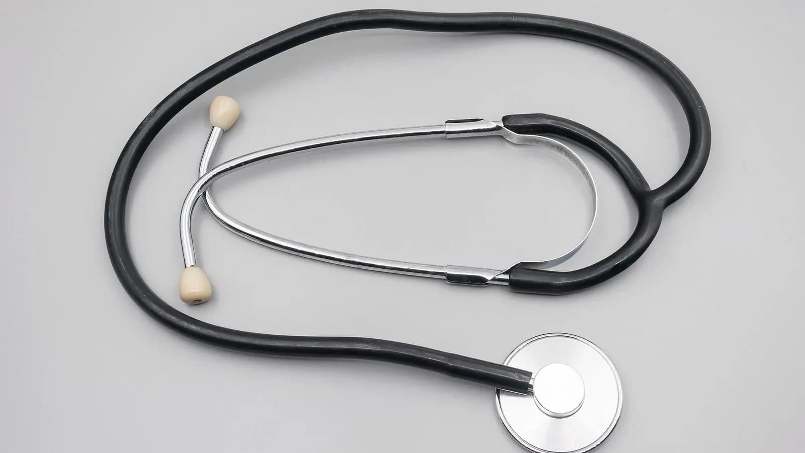 A stethoscope on a light gray surface