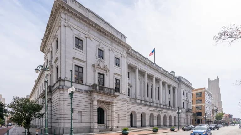 The granite and limestone John Minor Wisdom United States Court of Appeals Building in New Orleans, seen from the street