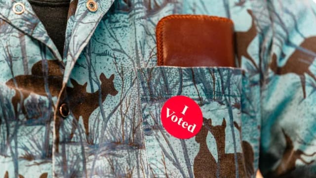 Close-up of an I Voted sticker on a shirt