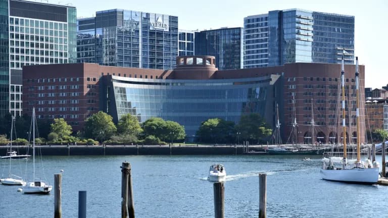 The John Joseph Moakley U.S. Courthouse on the Boston waterfront, with sailboats in the harbor