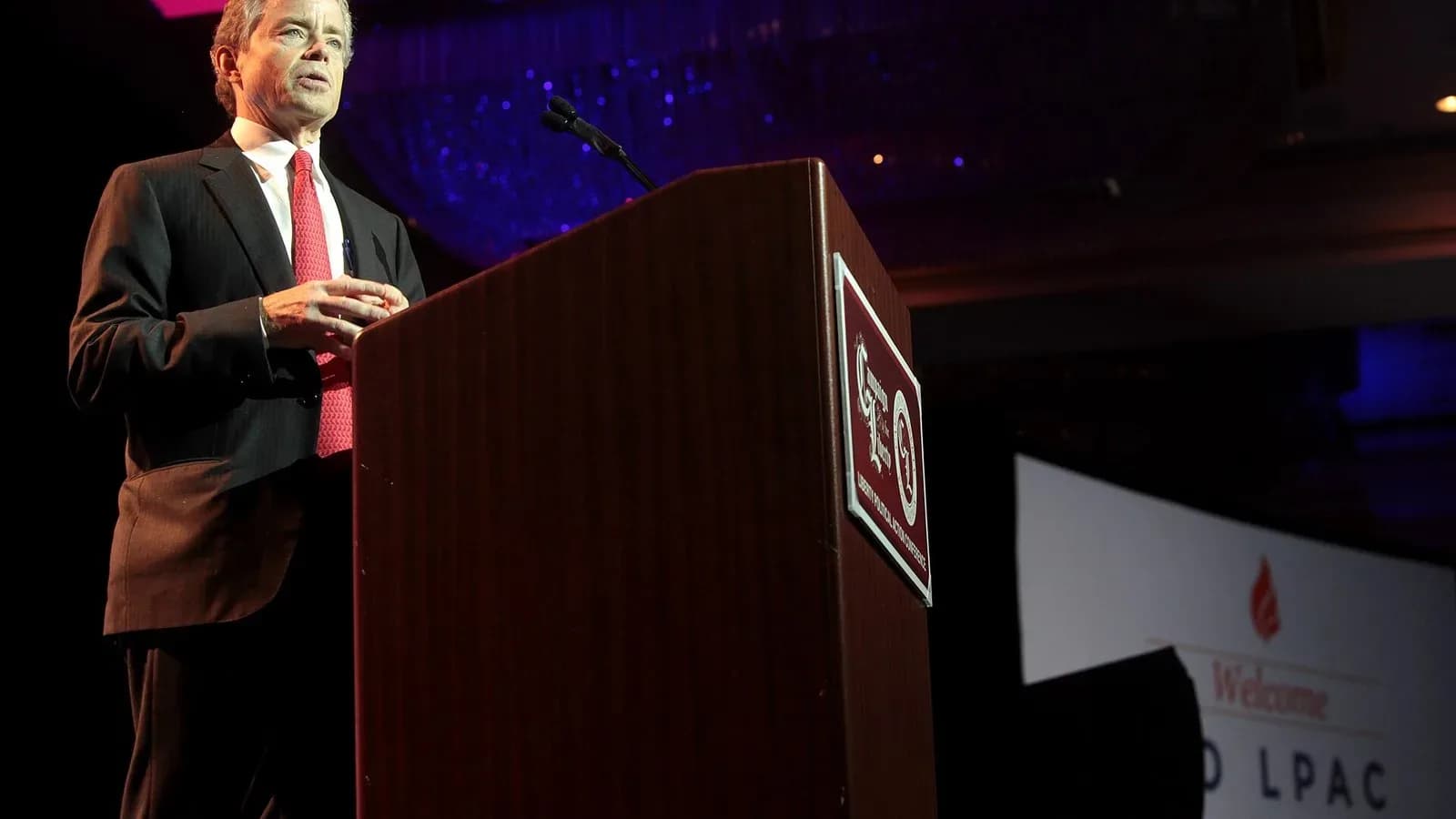 Don Huffines speaking at a podium