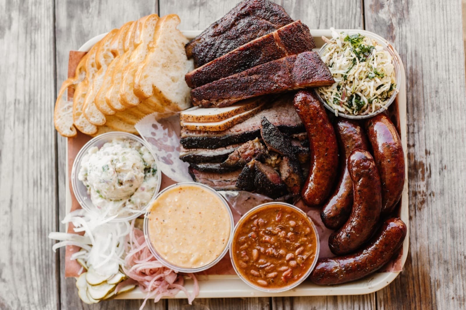 Goldee’s Bar-B-Q tray with brisket, ribs, sausage, and sides in Fort Worth