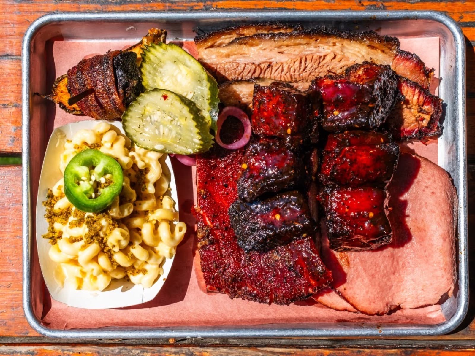 Panther City BBQ tray with brisket, ribs, burnt ends, and sides in Fort Worth