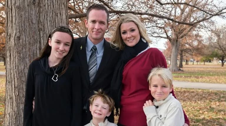 Jesse Mahan with his wife and children outdoors in Georgetown, Texas