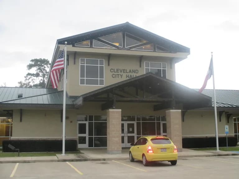 Cleveland City Hall in Cleveland, Texas, with the American and Texas flags