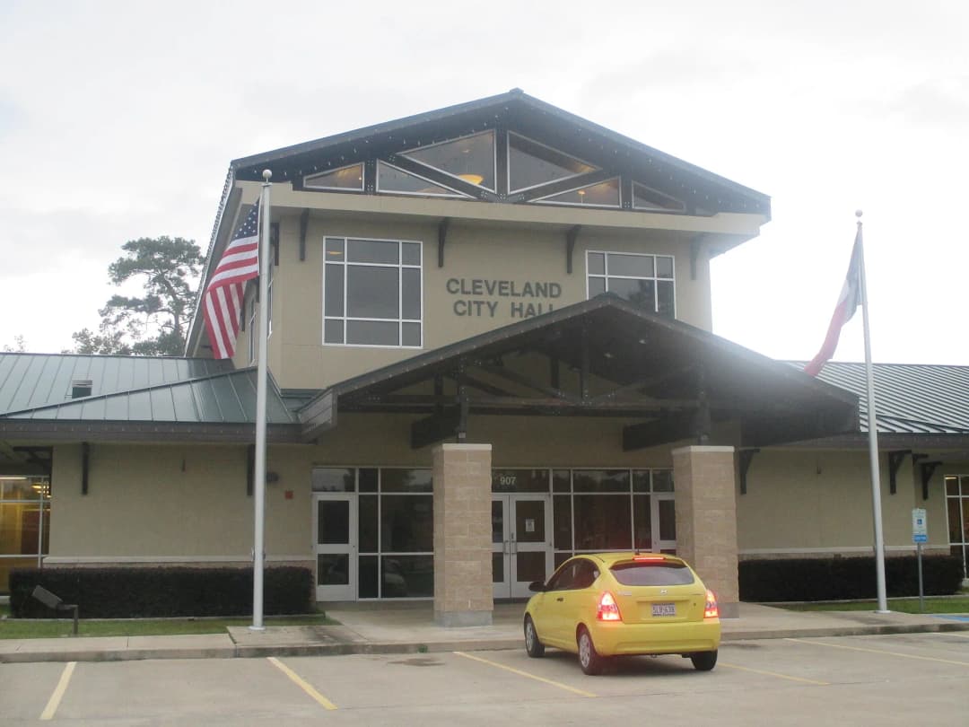 Cleveland City Hall in Cleveland, Texas, with the American and Texas flags