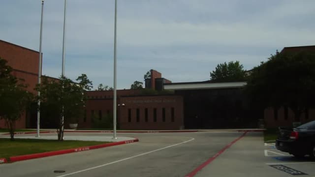 The Woodlands High School campus viewed from the parking lot
