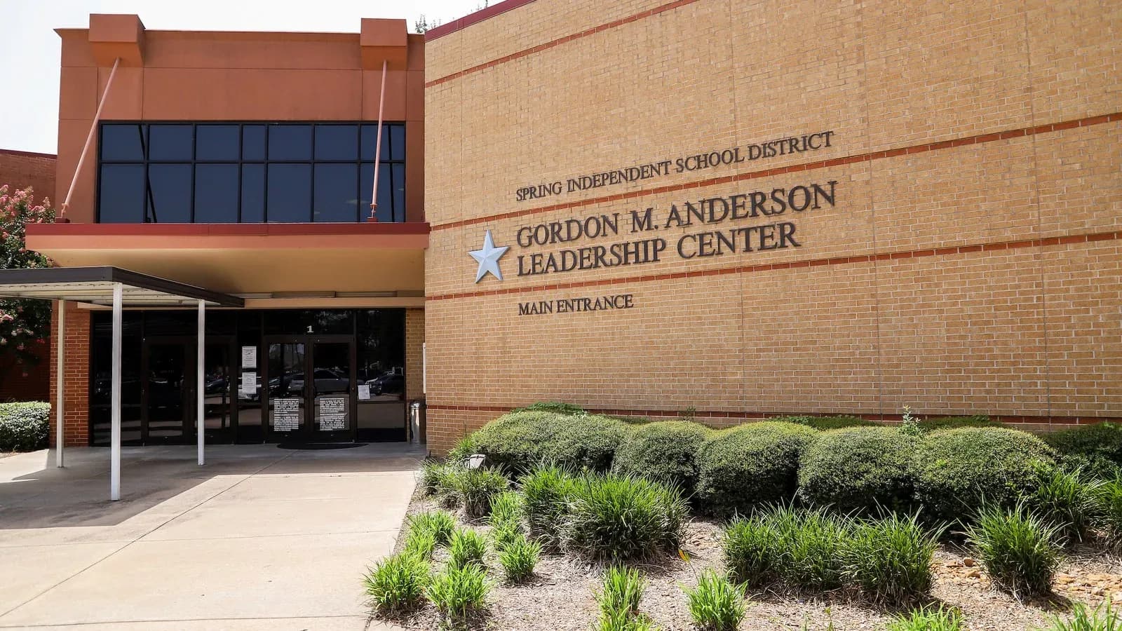 Spring ISD's Gordon M. Anderson Leadership Center, a tan brick building with the district's name on the facade