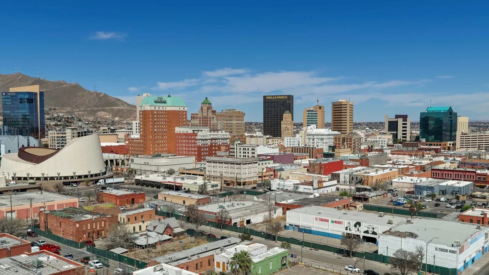 Downtown El Paso skyline with brick buildings, office towers and the Franklin Mountains behind