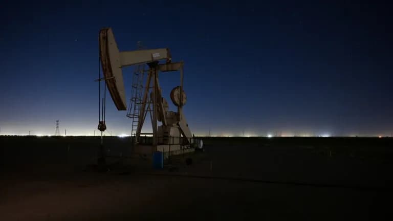 An oil pumpjack at night