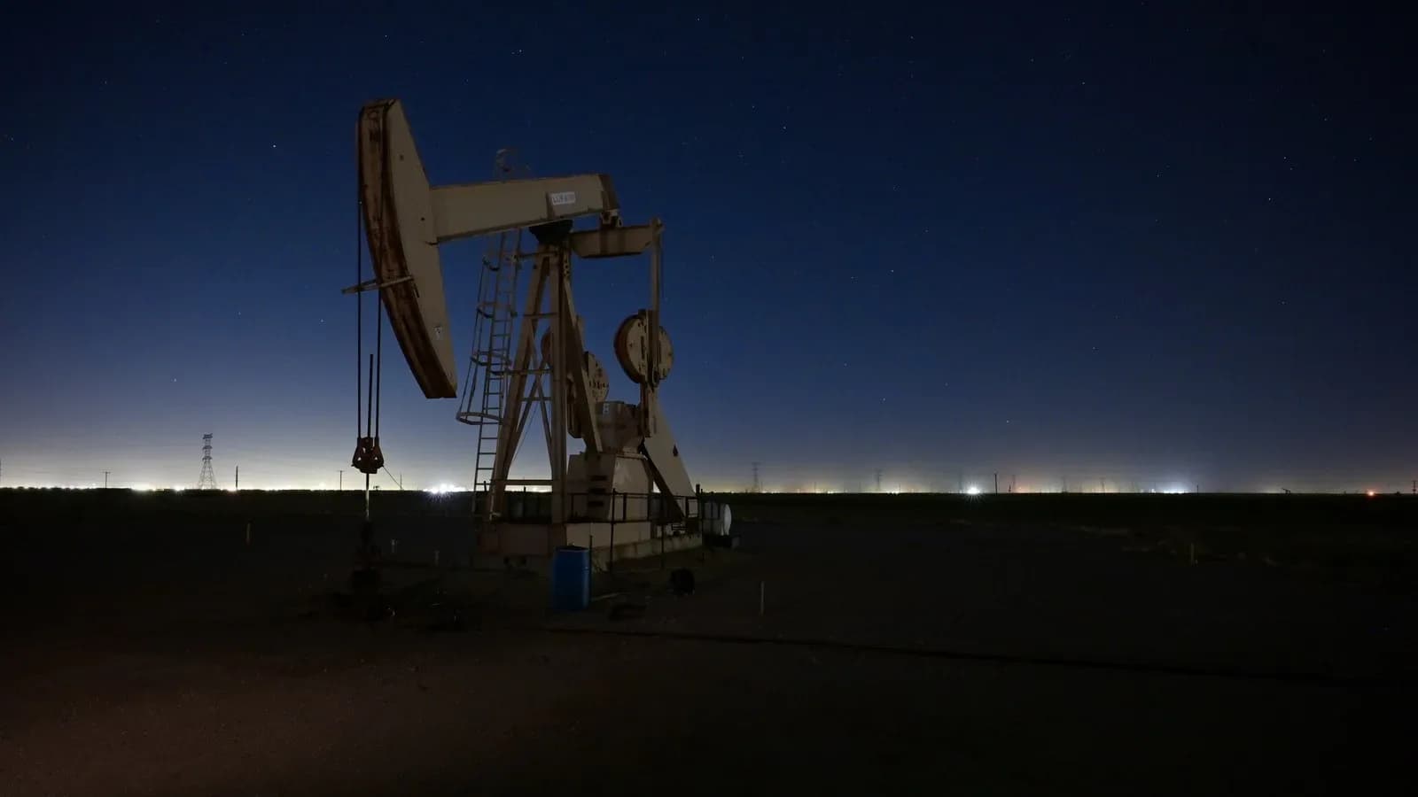 An oil pumpjack at night