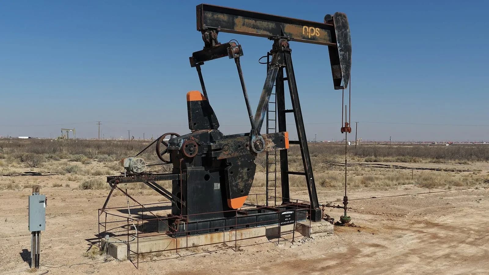 An oil pumpjack operating on a well in the Permian Basin of West Texas