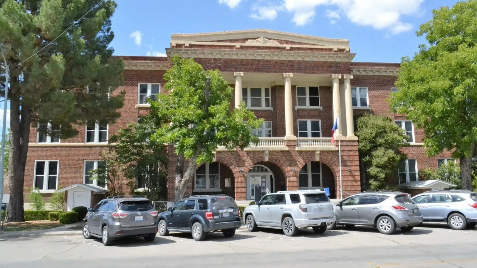 The Brown County Courthouse in Brownwood, Texas, under a blue sky