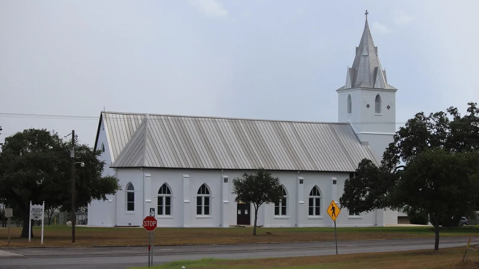 The white Immaculate Conception Catholic Church in Panna Maria, Texas, with its tall steeple
