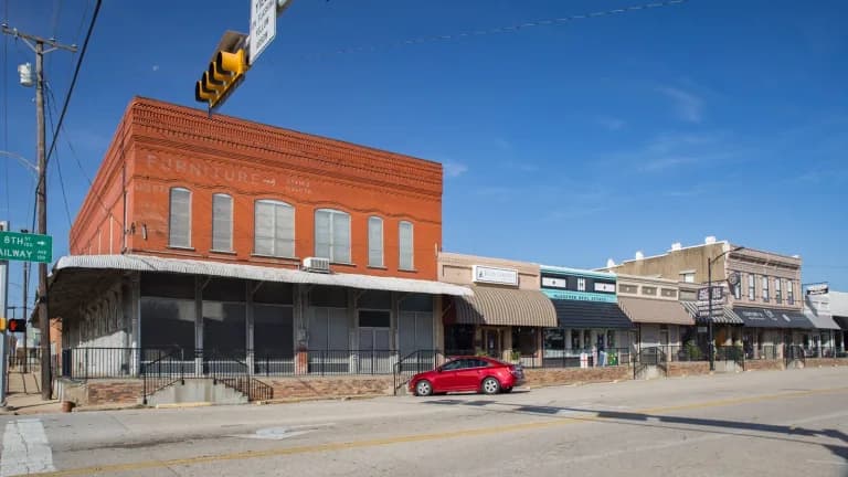 Brick storefronts along a downtown street in Midlothian, Texas