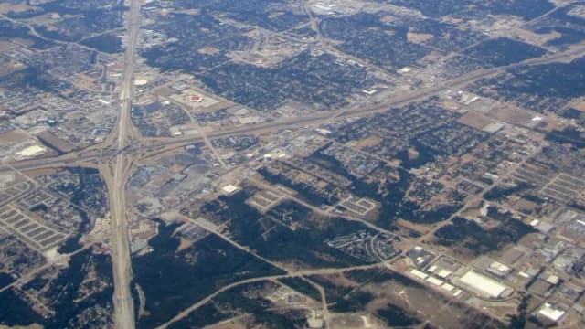 Aerial view of Duncanville, Texas, with highways and Joe Pool Lake in the distance