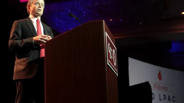 Don Huffines speaking at a podium