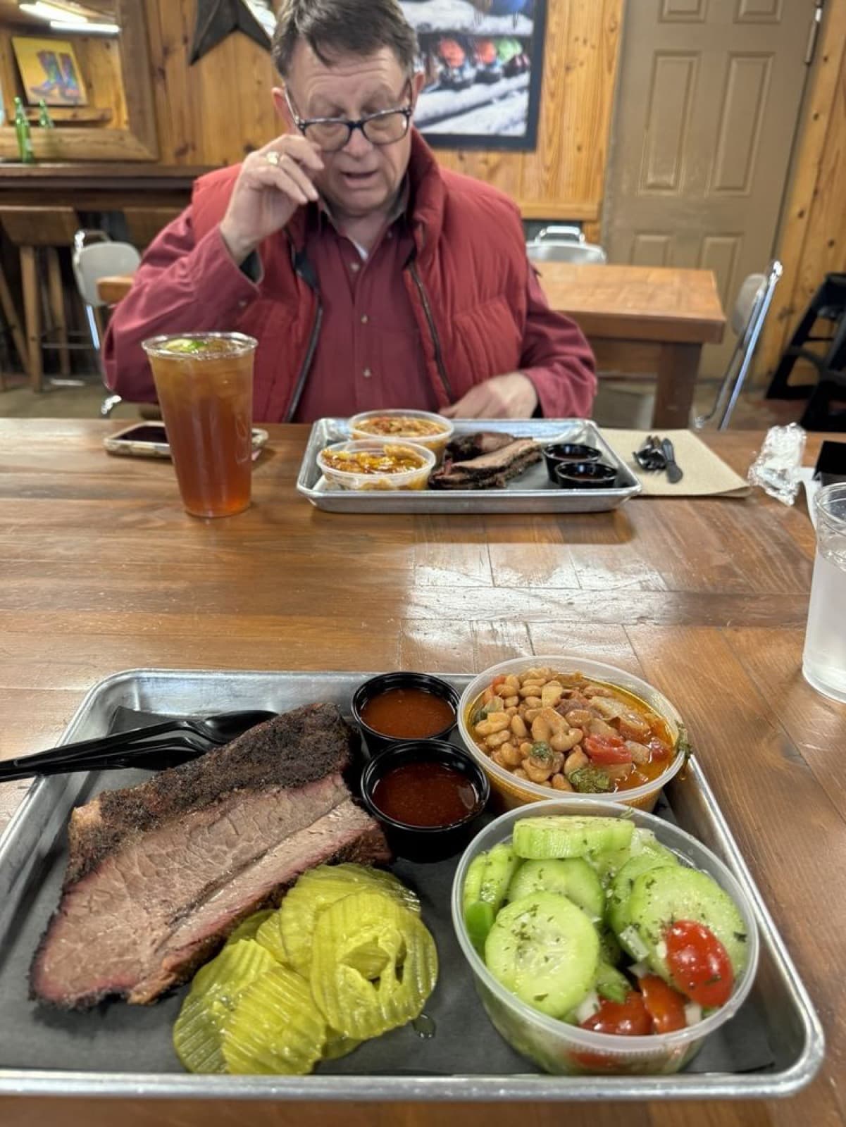 Schoepf’s BBQ brisket tray with pickles and sides in Belton, Texas