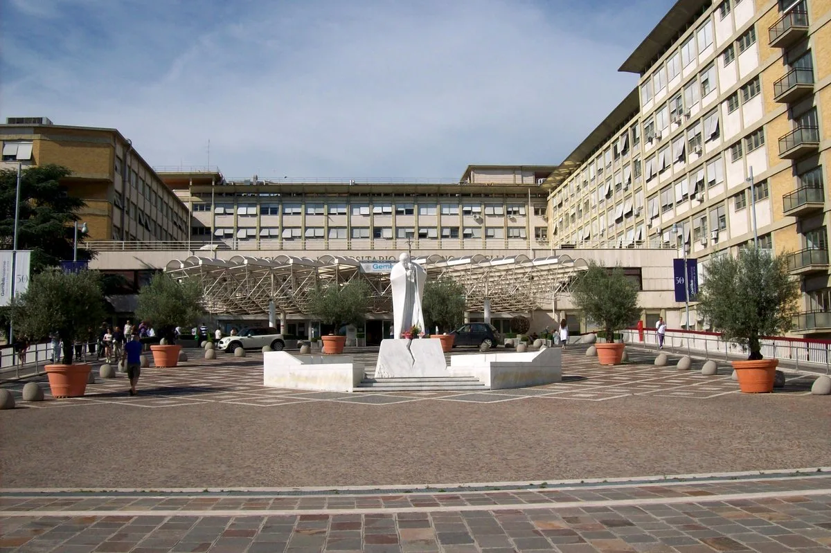 Gemelli university hospital in Rome, with a marble statue of Pope John Paul II out front