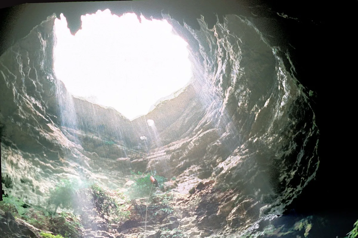 Looking up from inside Devil's Sinkhole toward its opening, in Edwards County