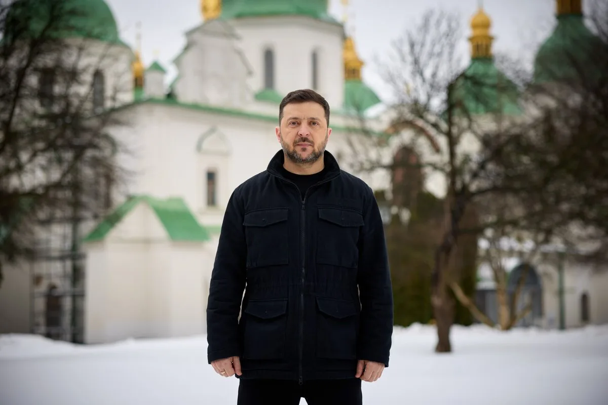 Ukrainian President Volodymyr Zelensky standing in the snow outside a church in Kyiv