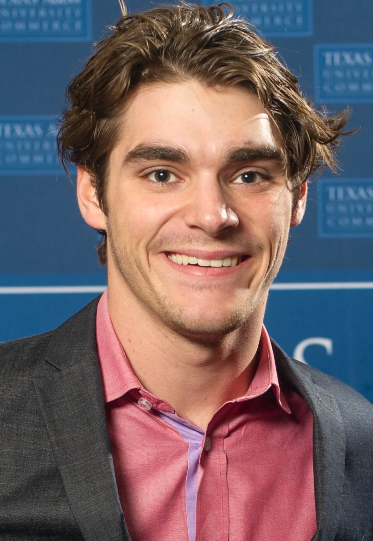 RJ Mitte smiling at a 2015 speaking event at Texas A&M University-Commerce