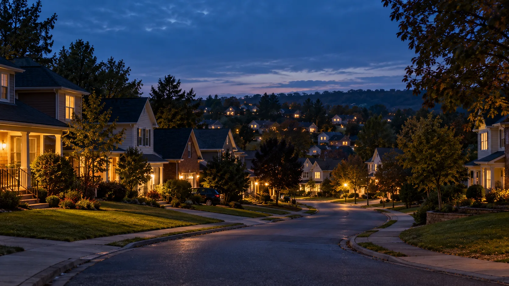 A quiet American neighborhood at blue hour with warm porch lights glowing on many homes.