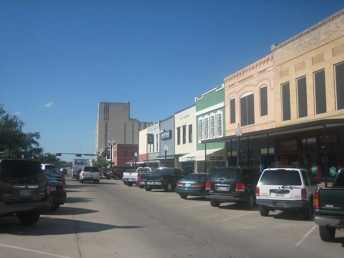 Historic brick storefronts along a street in downtown Bryan, Texas