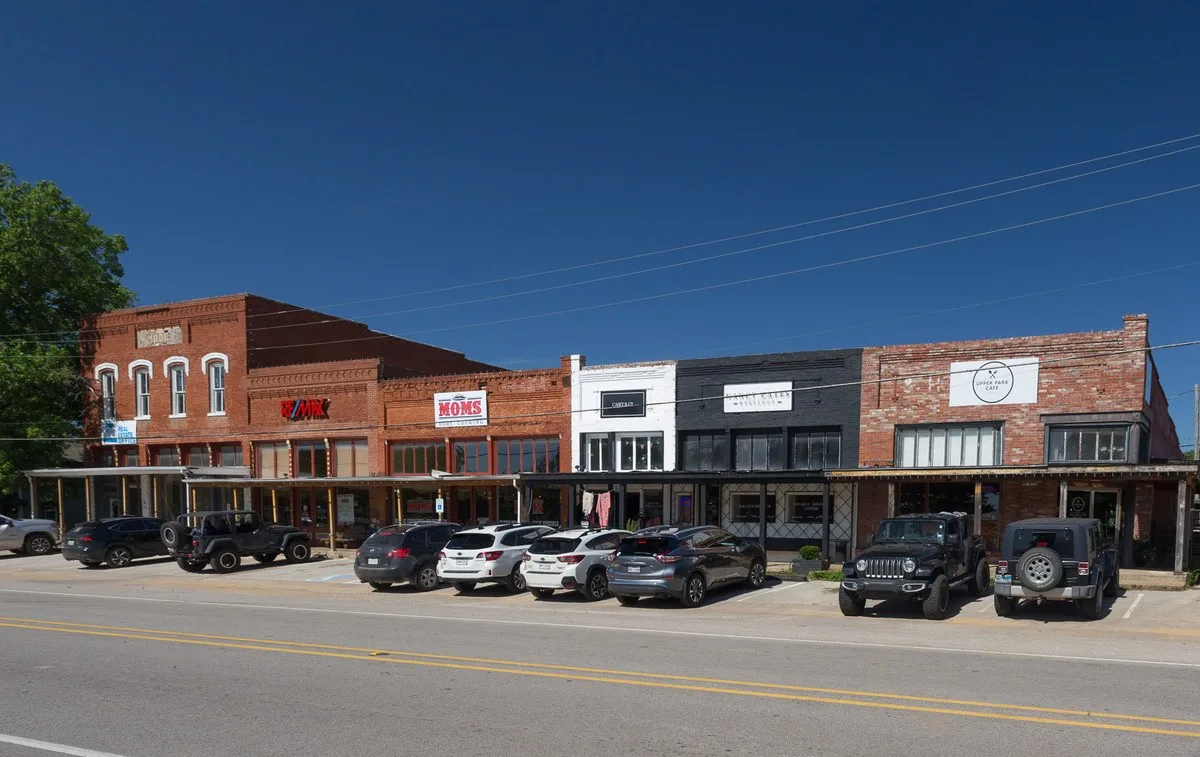 Storefronts along a street in downtown Aubrey, Texas