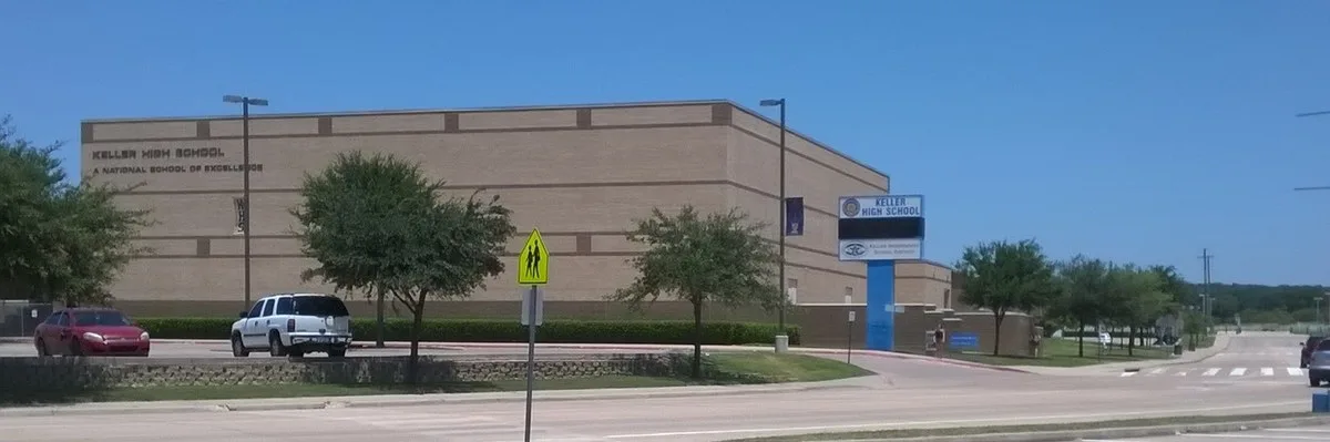 Wide view of Keller High School's front and parking lot