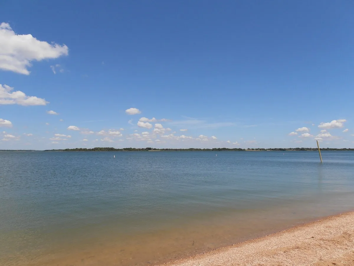 Lake Lavon shoreline and blue sky at East Fork Park in Wylie, Texas