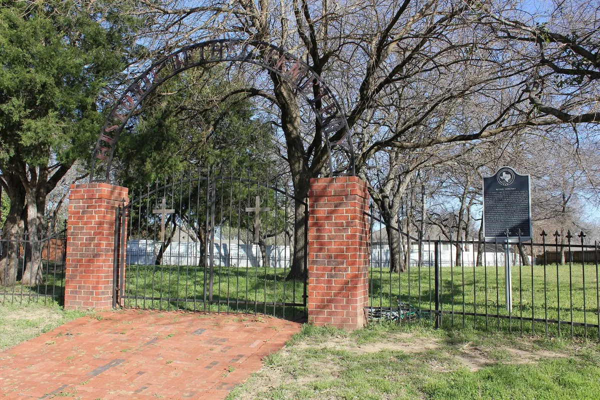 The brick gateway and historical marker at Bethel Cemetery in Coppell, Texas