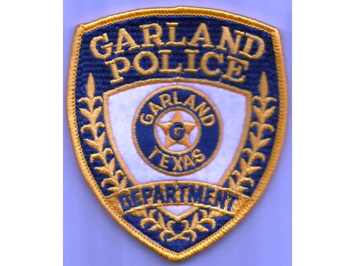 An embroidered blue and gold Garland Police Department shoulder patch