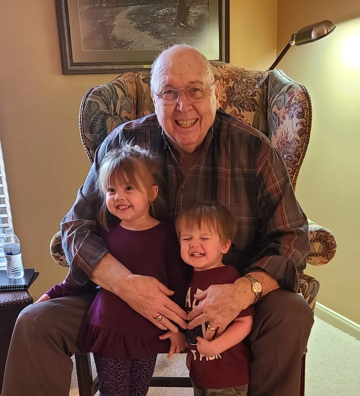 Gerald Mounce with two of his great-grandchildren