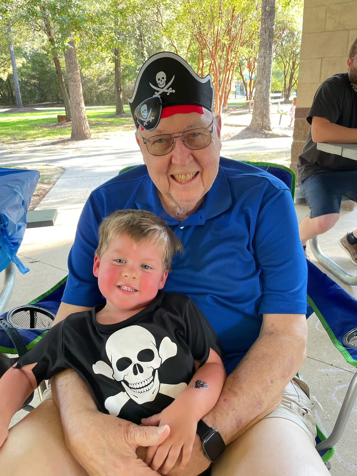 Gerald Mounce in a pirate hat with his great-grandson at a birthday party