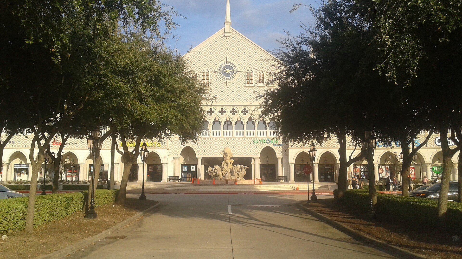 Portofino Shopping Center in Shenandoah, Texas, a clock-tower retail building along the freeway