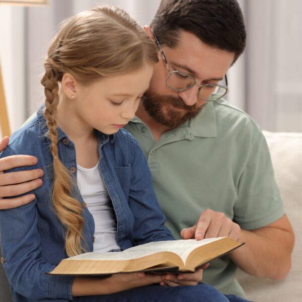 Young Family Reading NIV Bible